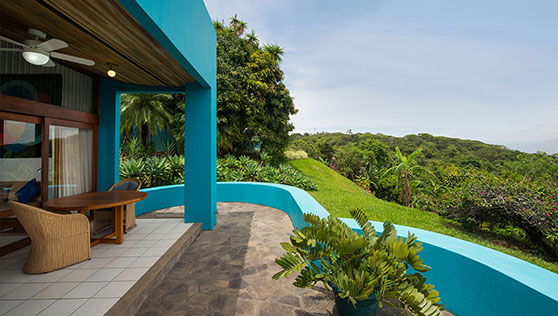 Private balcony with open expanse of rainforest valley and San Jose town